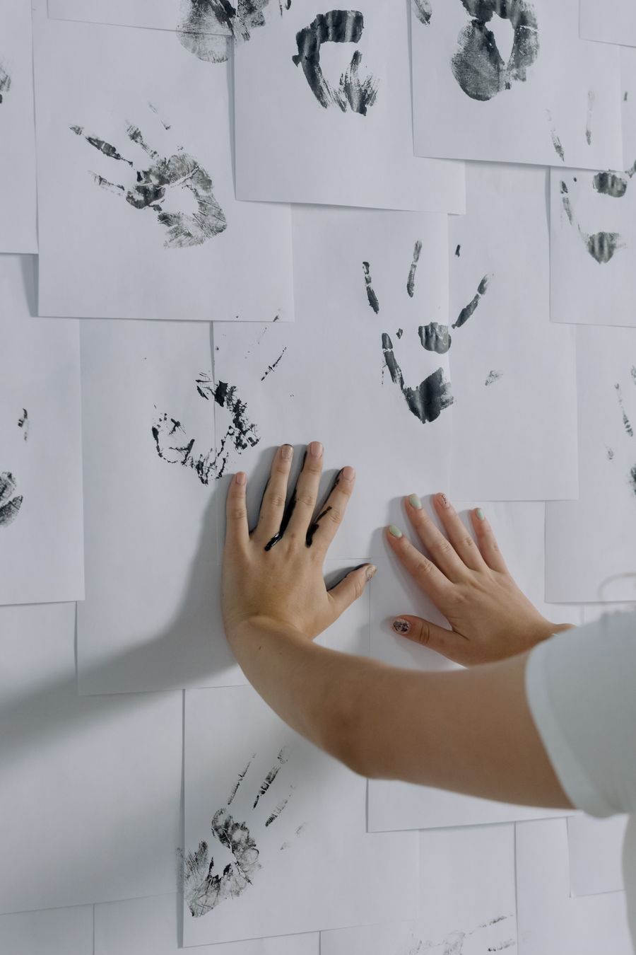Person hands making prints on papers on wall — stock photo for Privacy Policy