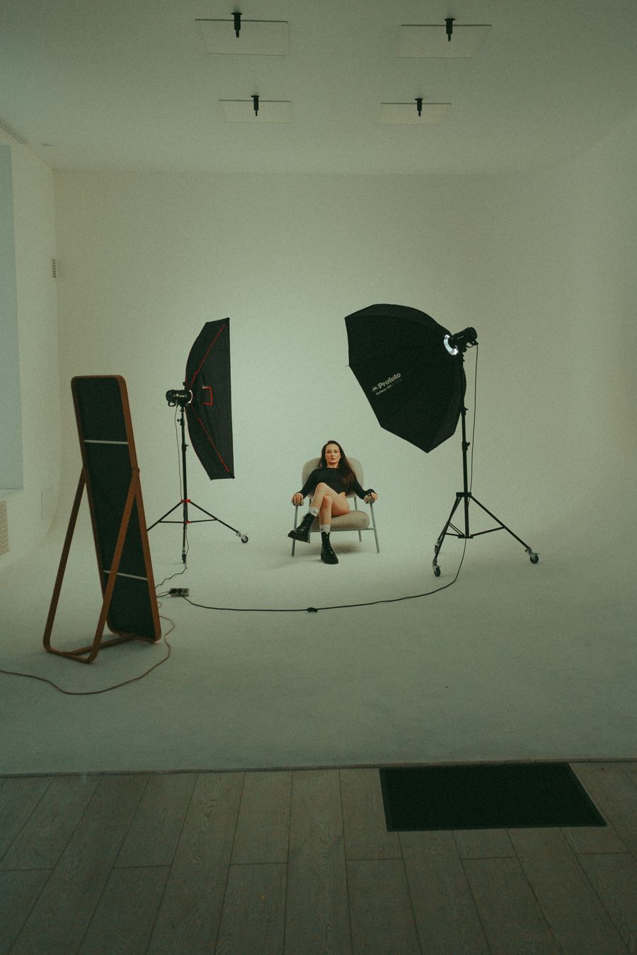 A woman sitting in a studio — stock photo for Suggest a Color Palette