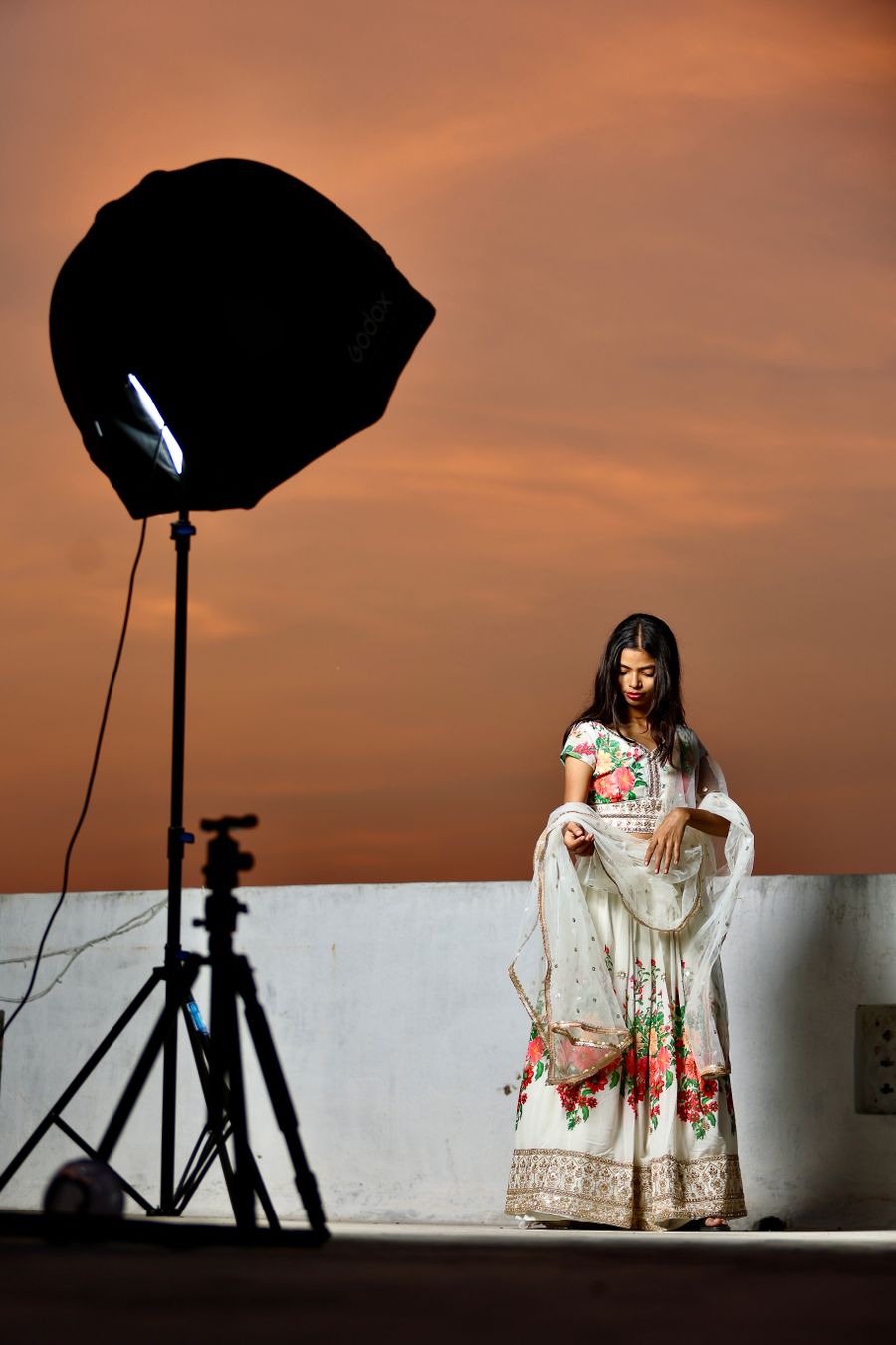 A woman wearing a white dress in a photoshoot — Brand Kits templates dashboard mockup