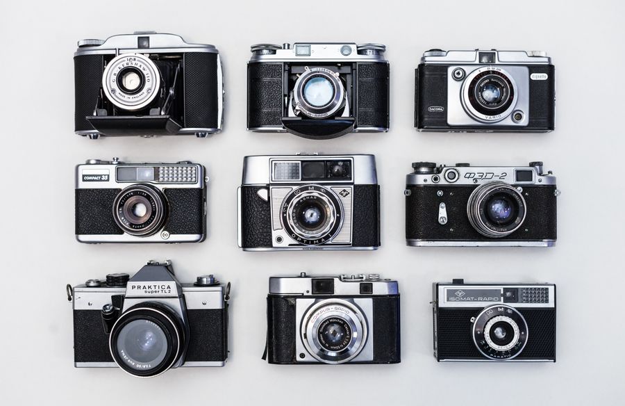 Nine black and gray cameras — stock photo for PhotoAI Company — AI photo & design editor