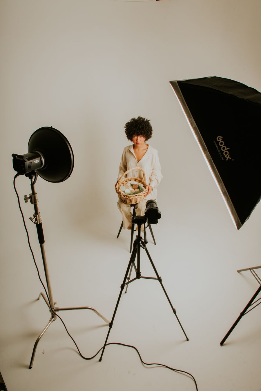 A woman sitting in a studio — Start designing free browser mockup