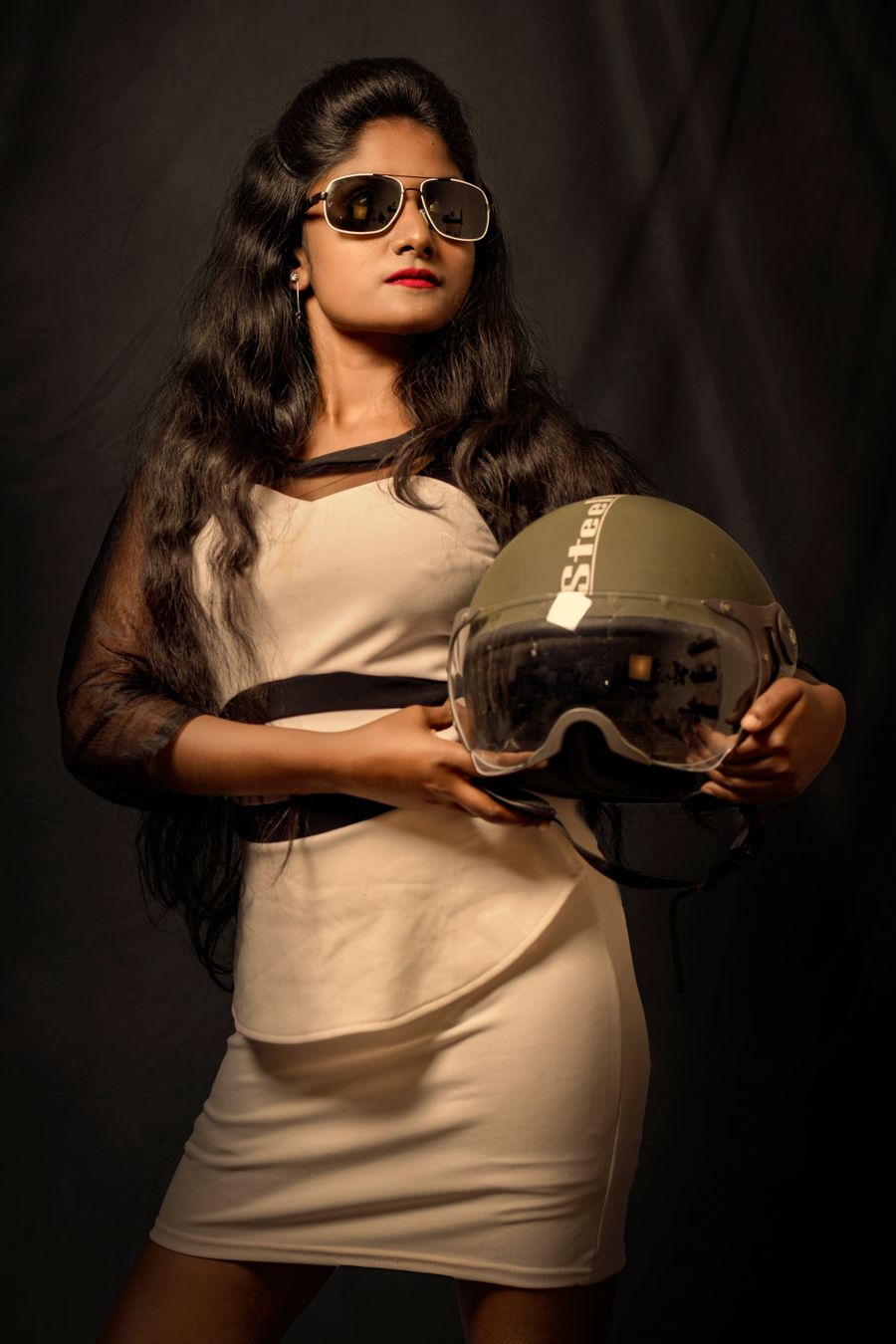 Photo of a girl holding a green helmet — design technique