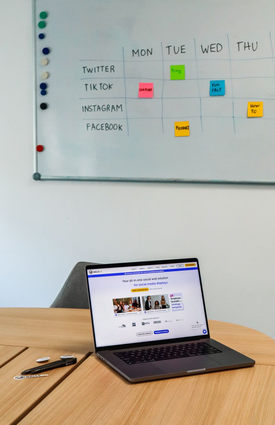 Laptop on table in conference room with whiteboard — Brand Kits templates resize-canvas mockup