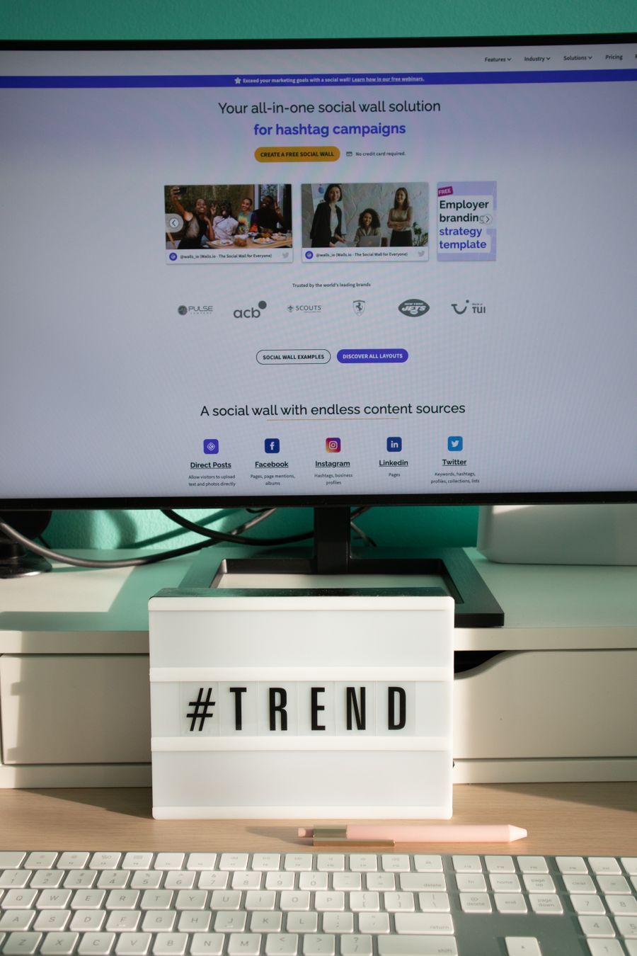 A light box with letters standing on a desk next to a monitor and keyboard — Documents templates dashboard mockup