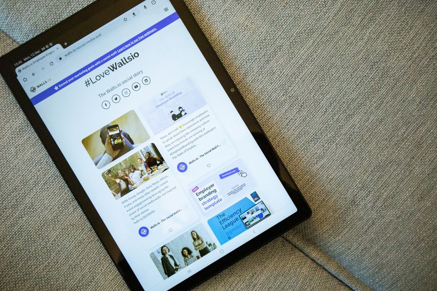 Tablet displaying front page of walls io website — Video templates layers-panel mockup