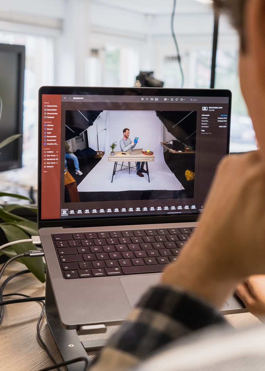 Man editing a video on a laptop — Export a Design annotated figure