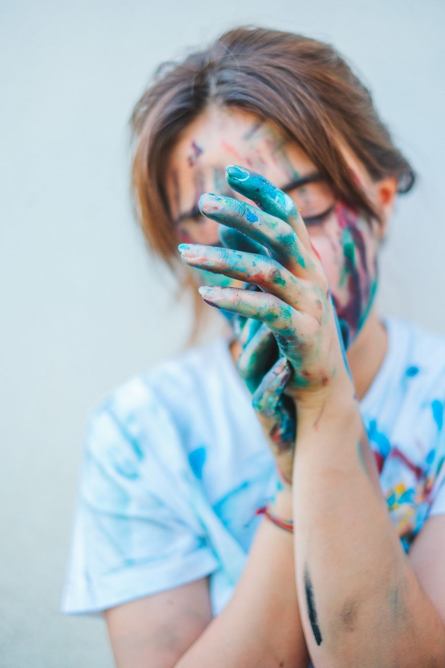 Girl with hands covered in paint — stock photo for Instagram Posts & Stories templates