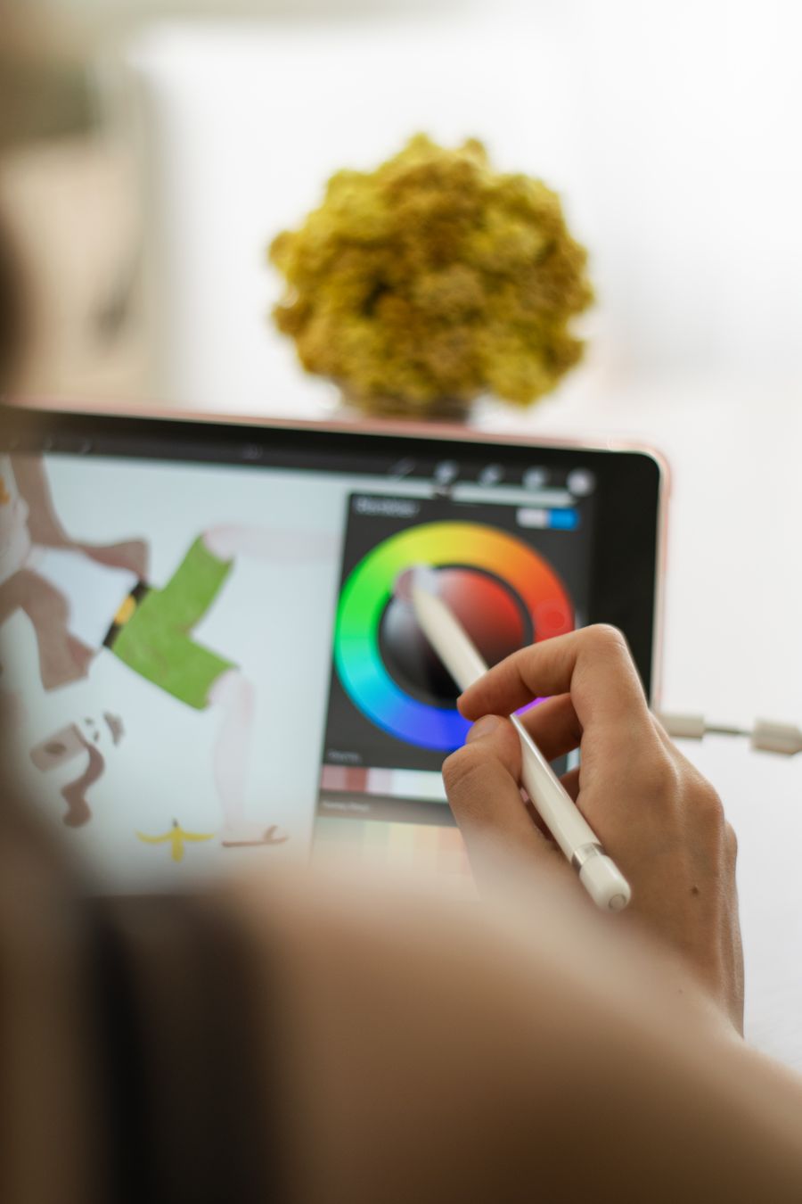 A person using a drawing tablet — Simple pricing, no watermarks, no gotchas phone mockup