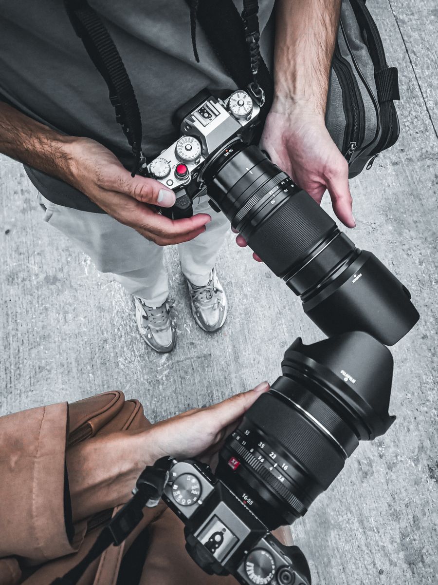 Man and woman holding cameras — stock photo for Remove Background