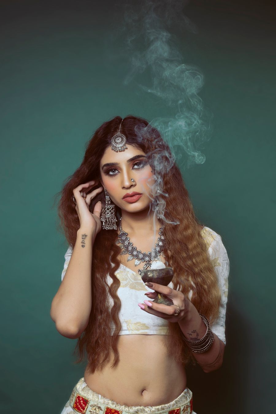 Brunette posing in traditional jewelry — Add Text template-card mockup