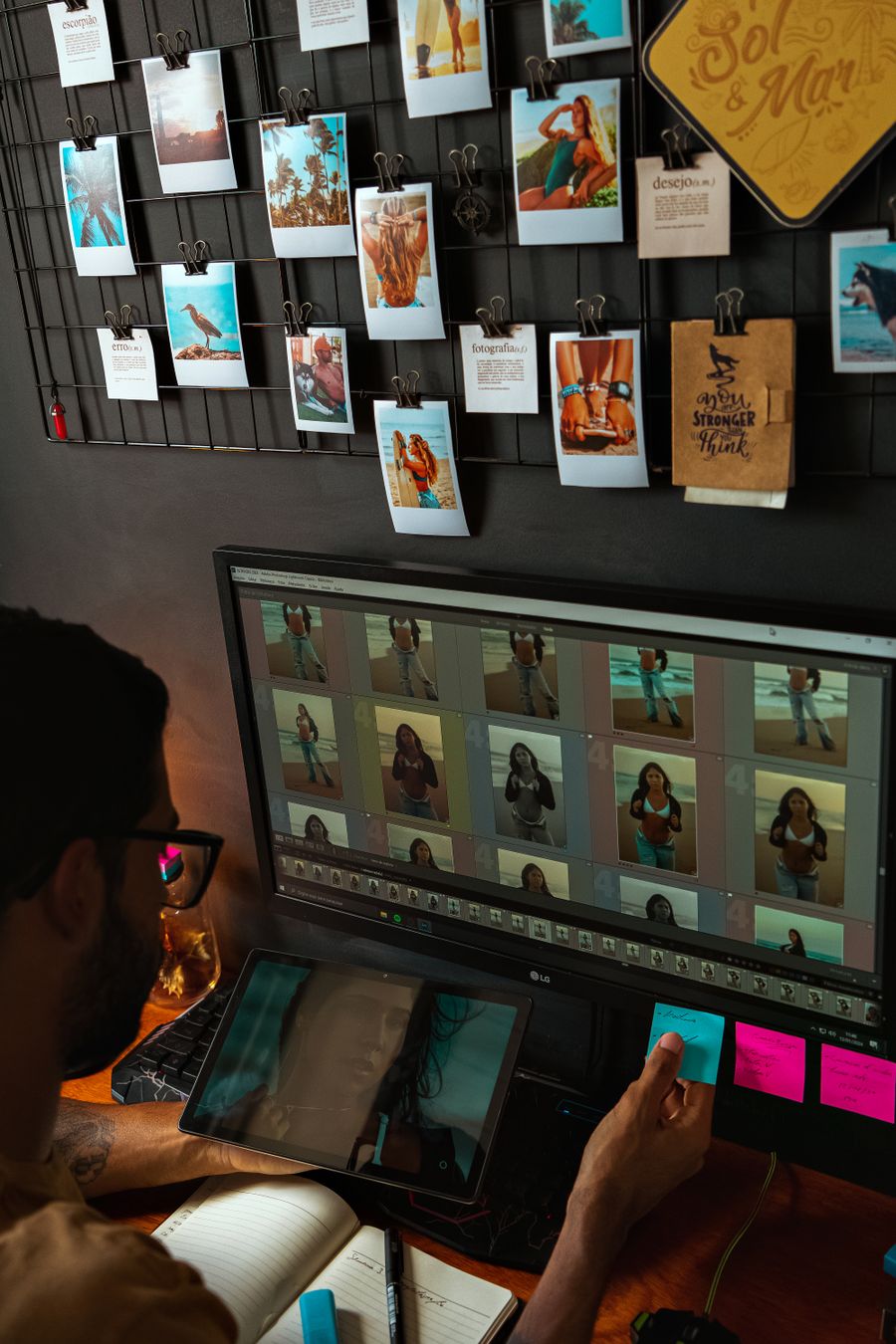 A man viewing pictures on a computer screen — stock photo for PhotoAI Company — AI photo & design editor