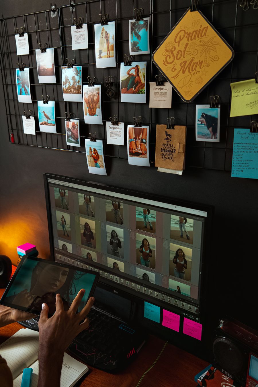 Hand of a photographer browsing photos on a computer — stock photo for Simple pricing, no watermarks, no gotchas