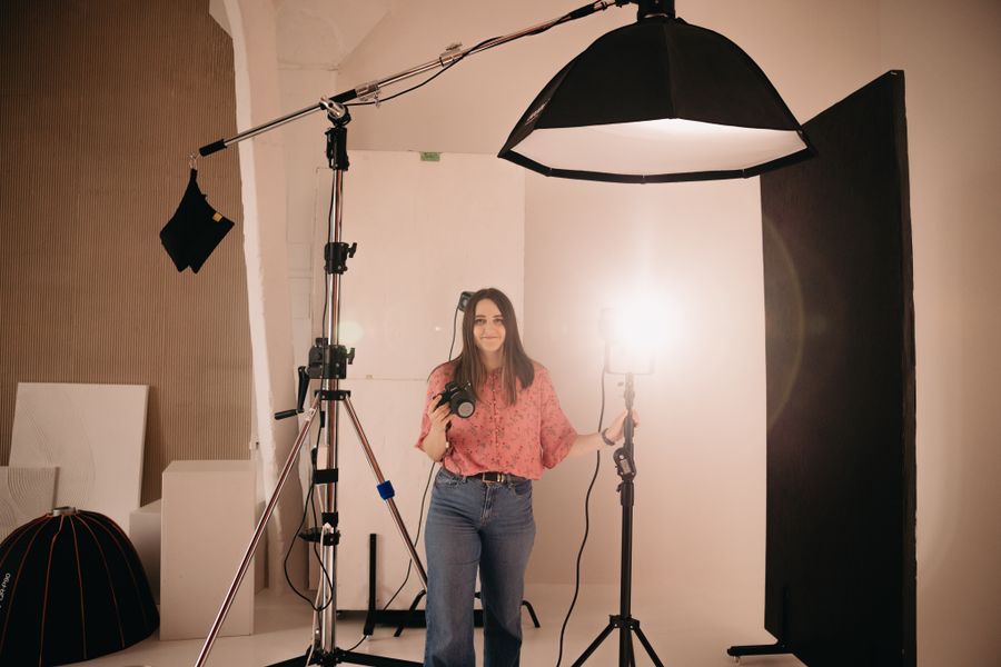 Photographer arranging light in studio — Print-ready PDFs with bleed control