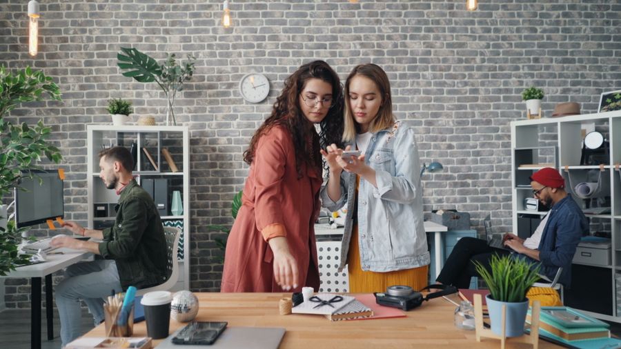 Women taking photos of the composition prepared on the table — stock photo for Presentations templates