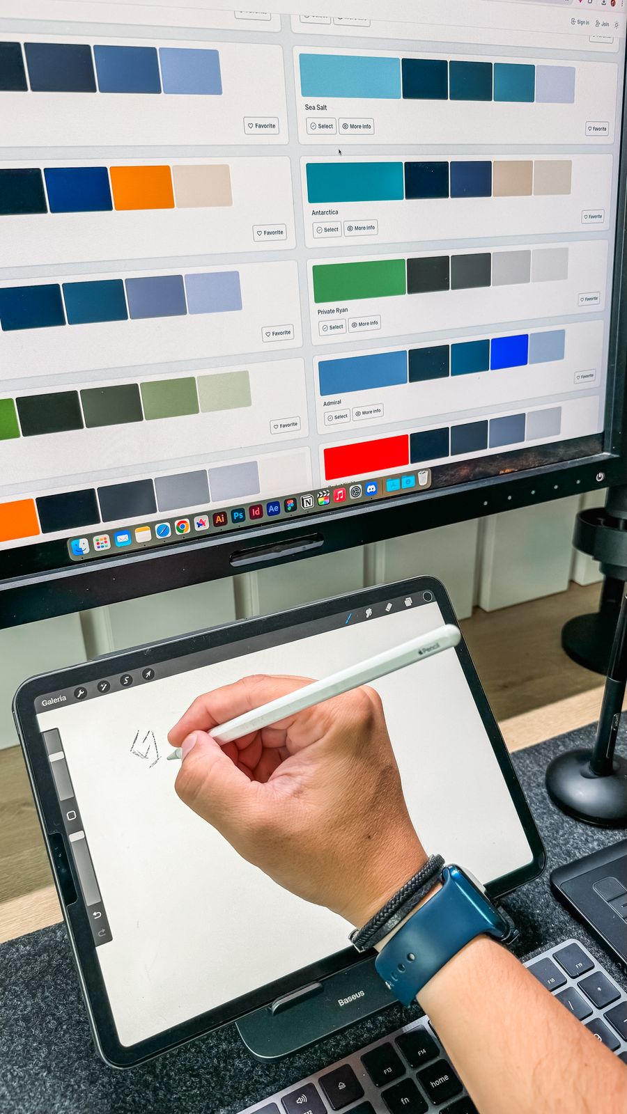 Hand of a man drawing on a tablet touchscreen — Export a Design dashboard mockup