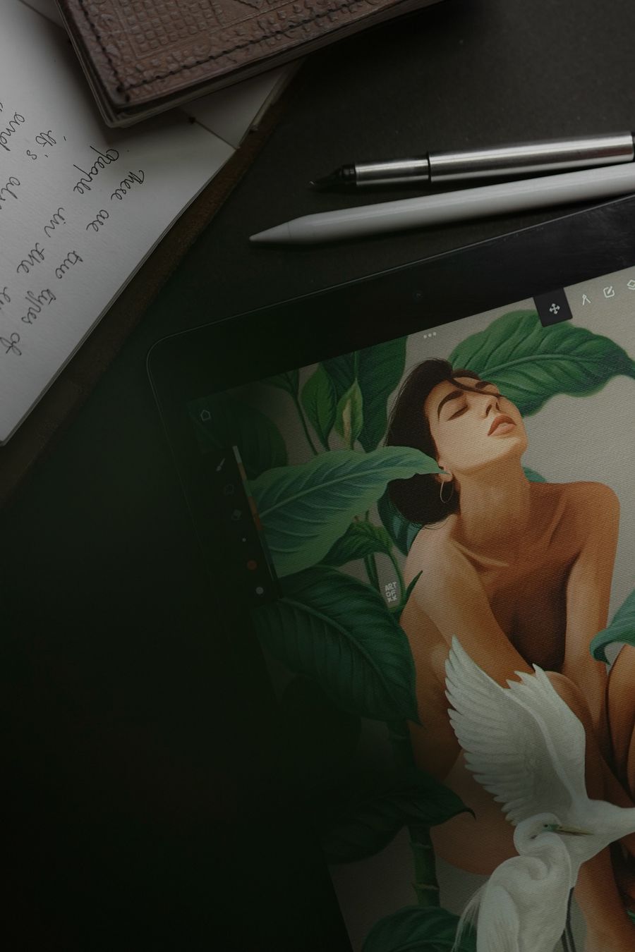 Drawing tablet among pens and notebooks — Add Text technique