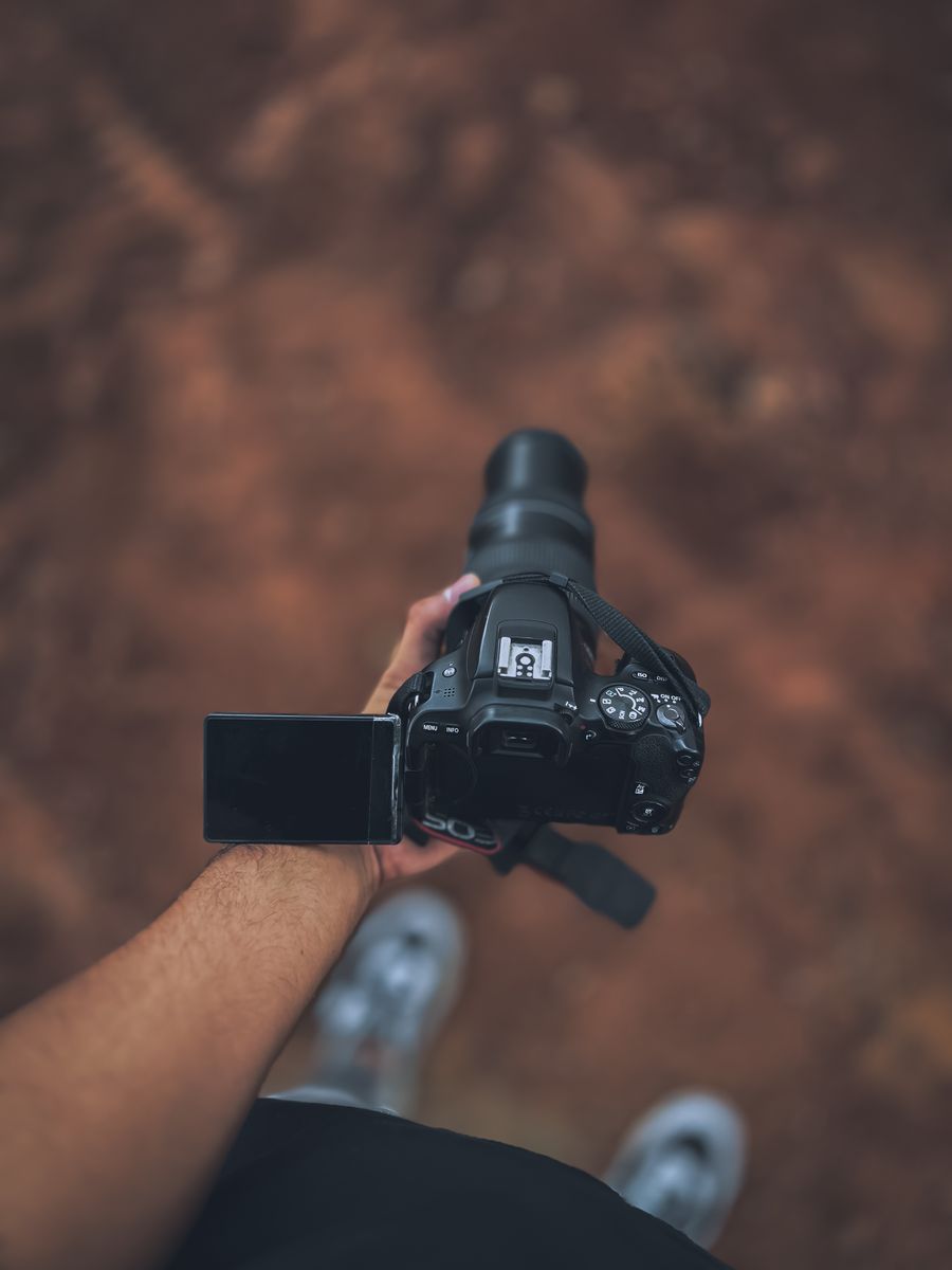 A person holding a camera in their hand — stock photo for Remove Background