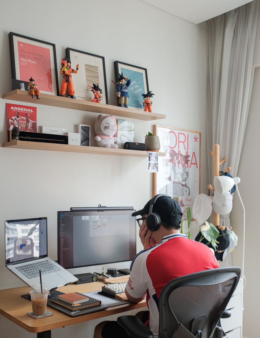 A man sitting at a desk with a computer — stock photo for Simple pricing, no watermarks, no gotchas
