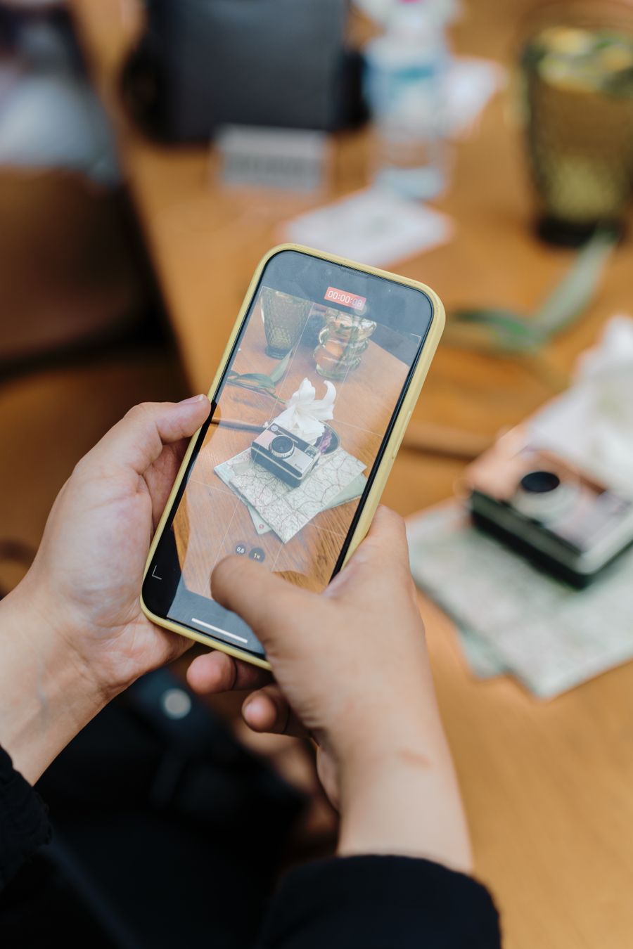 A person holding a cell phone with a picture of a person — stock photo for Everything in the editor, honestly described