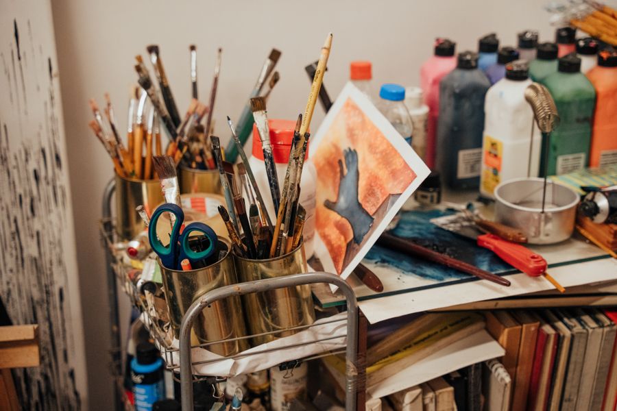 Creative art studio with brushes and paints — Simple pricing, no watermarks, no gotchas motion card