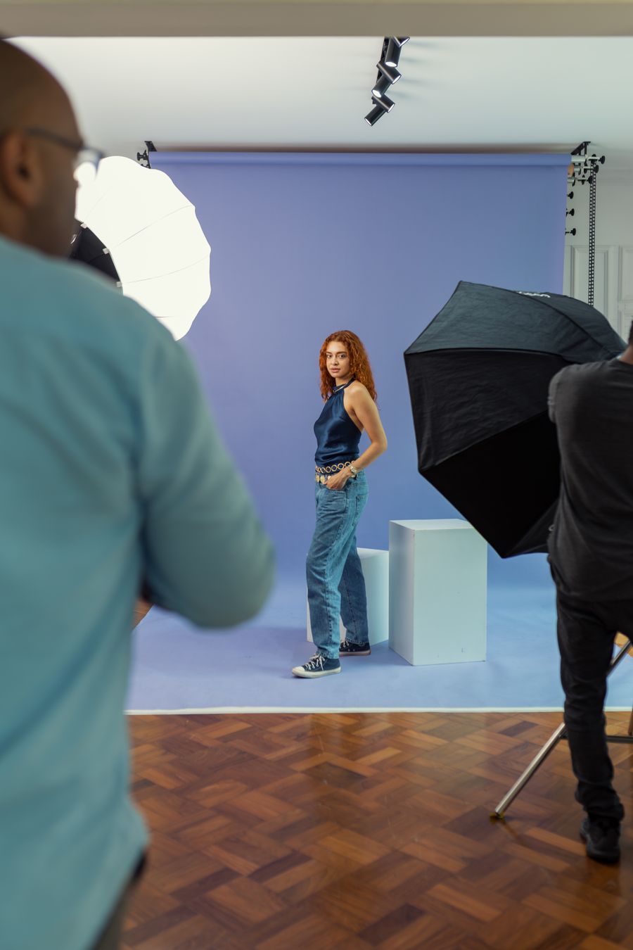 Model posing in professional photo studio setup — Add an Image template-card mockup