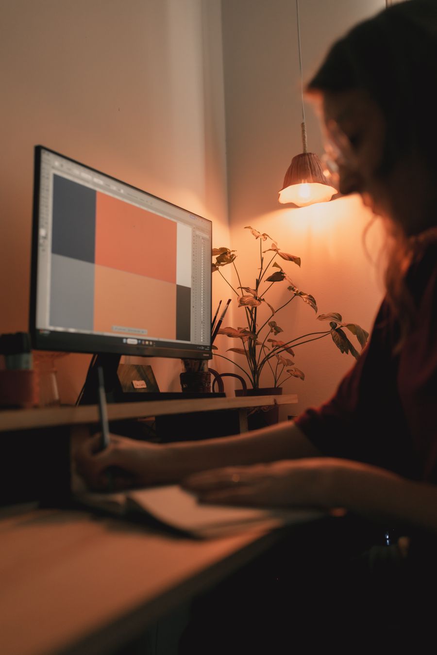 Creative workspace with designer at desk — Create a Design editor mockup