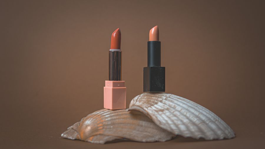 Elegant lipsticks on seashell display — Remove Background export-dialog mockup