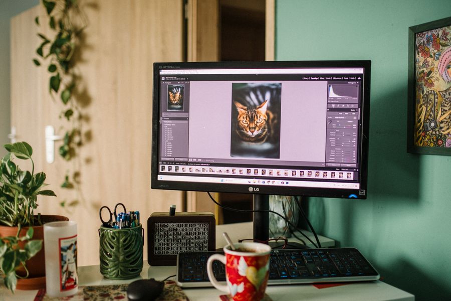 Home office desktop with editing software on screen — Instagram Posts & Stories templates layers-panel mockup