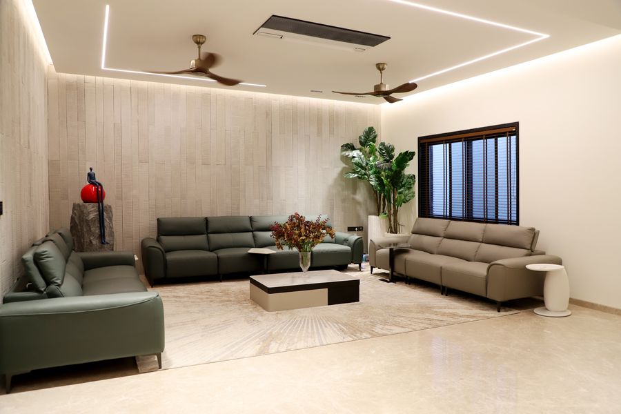 Modern living room with green sofas and indoor plants — stock photo for Create a Brand Kit