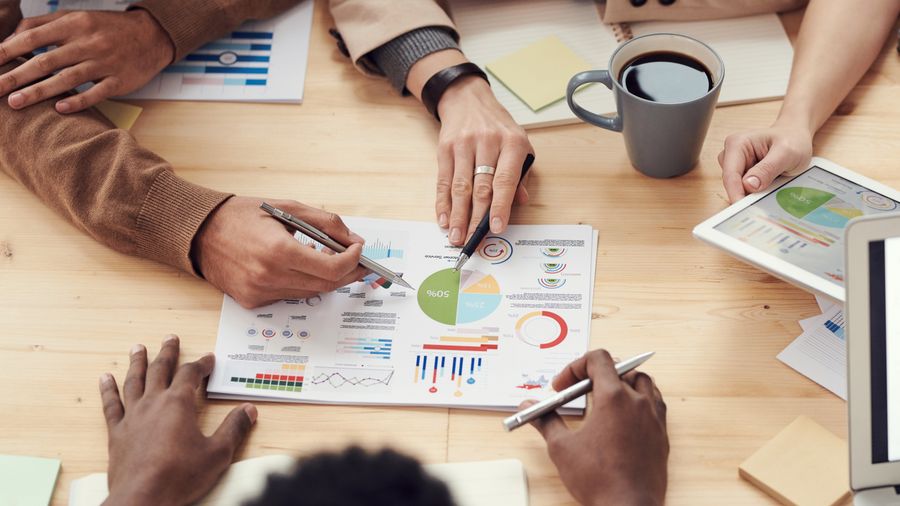 People discuss about graphs and rates — stock photo for Advertisements templates