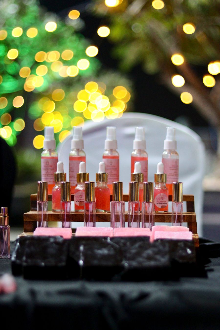 Elegant display of pink beauty products at night — Export a Design resize-canvas mockup