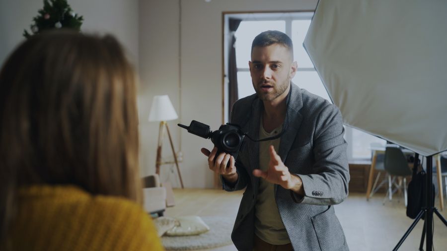 Photographer directing model in studio setting — after Export a Design