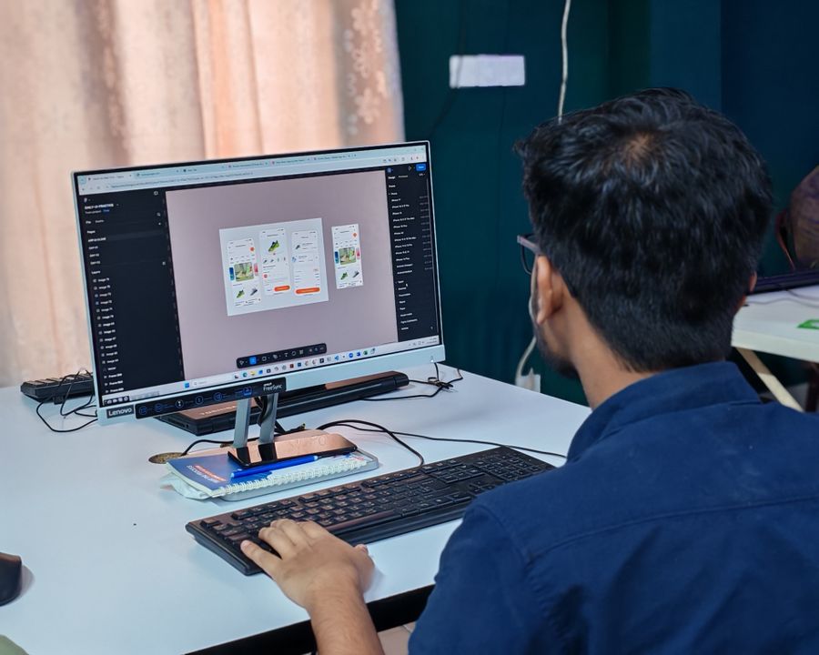 Young designer at work creating ui on desktop — stock photo for Export a Design