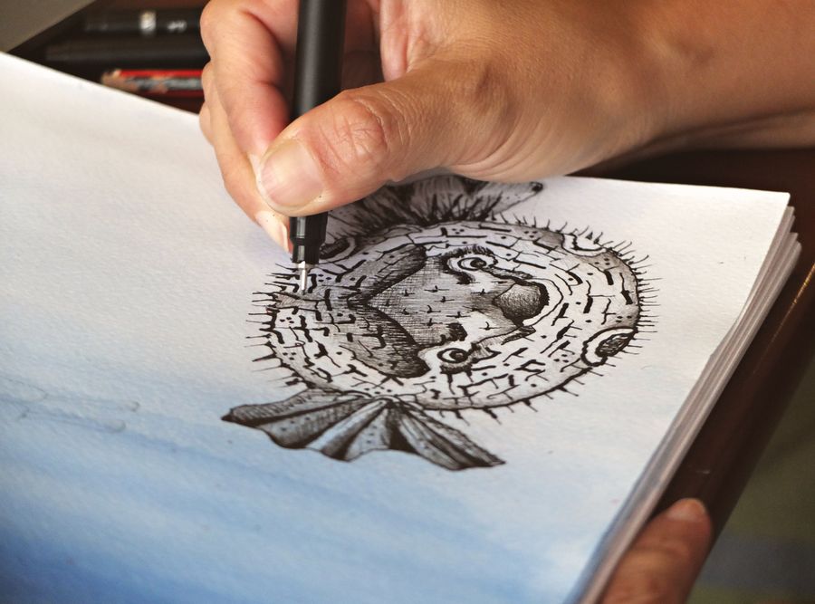 Hand drawing pufferfish sketch on paper — stock photo for PhotoAI Company — AI photo & design editor