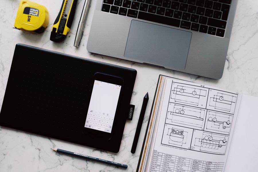 Modern workplace with gadgets and opened notebook with pen and pencil on marble table at home — stock photo for Remove Background