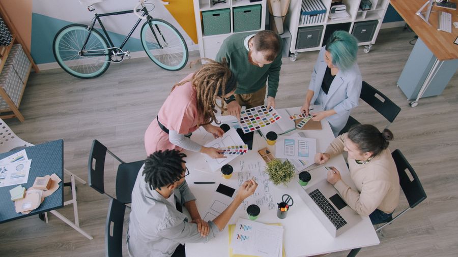 Creative team collaborating on project in office — Export a Design dashboard mockup