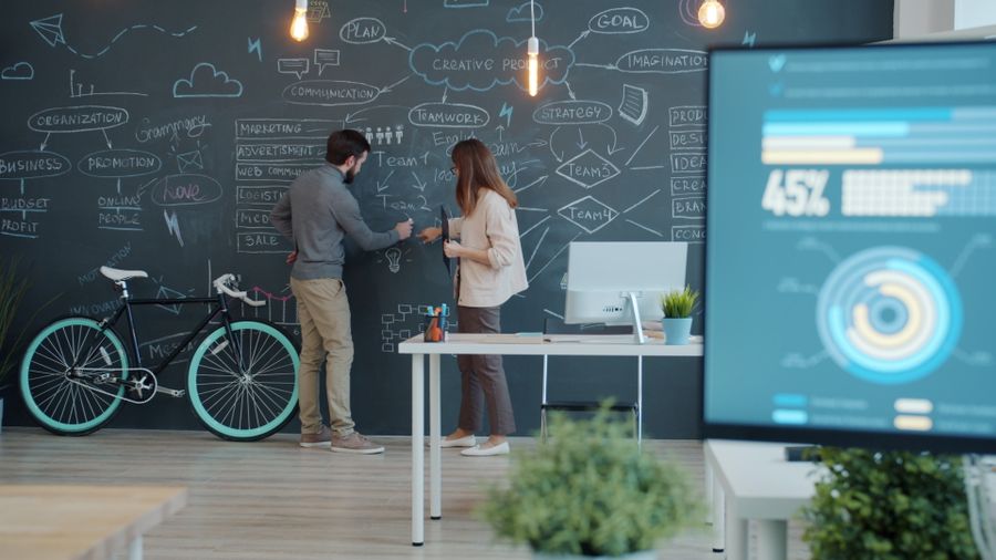 Creative office brainstorming session with chalkboard — Export a Design browser mockup