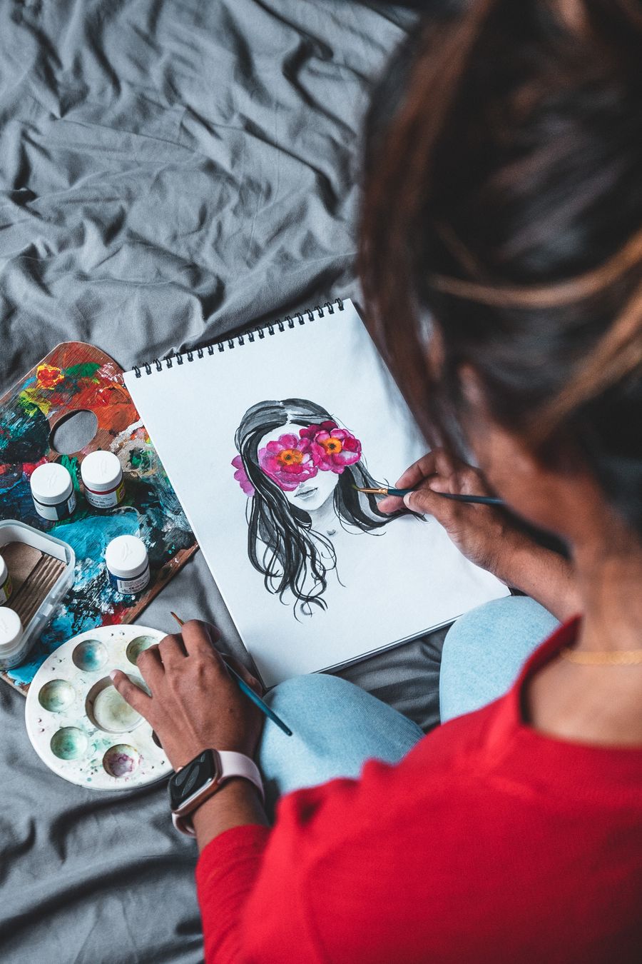Photo of person painting on white paper — Documents in use