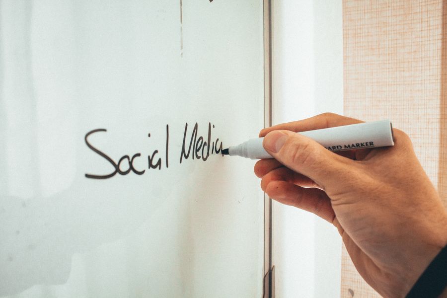 Unrecognizable man taking notes on whiteboard — Advertisements templates browser mockup