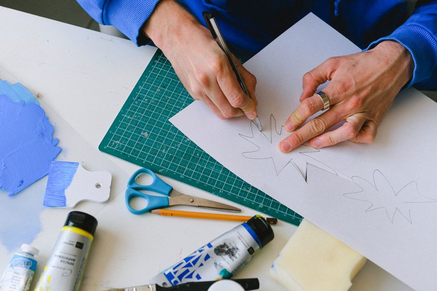 Crop person drawing sketch on paper — Export a Design resize-canvas mockup