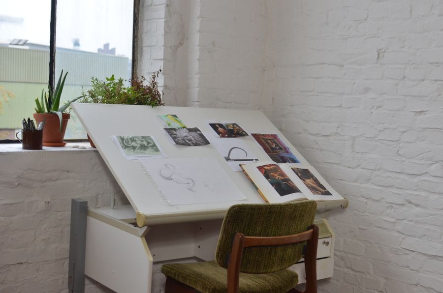 Workplace with artworks for inspiration of designer — design technique