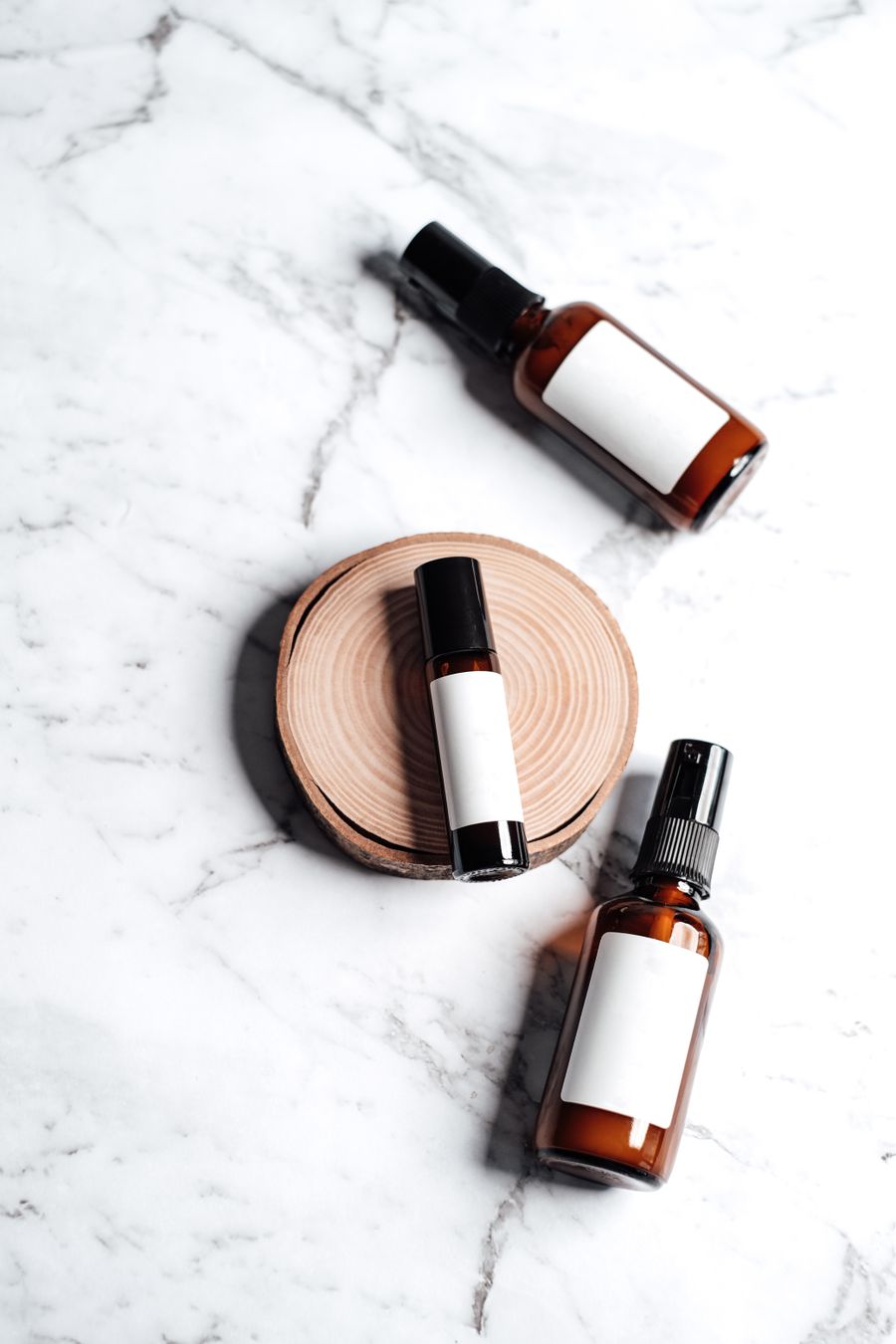 Brown glass bottles on marble surface — stock photo for Export a Design