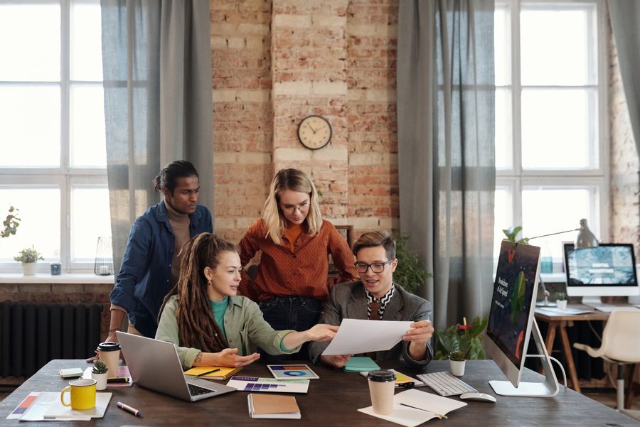 A group of people discussing marketing plans — stock photo for Terms of Service