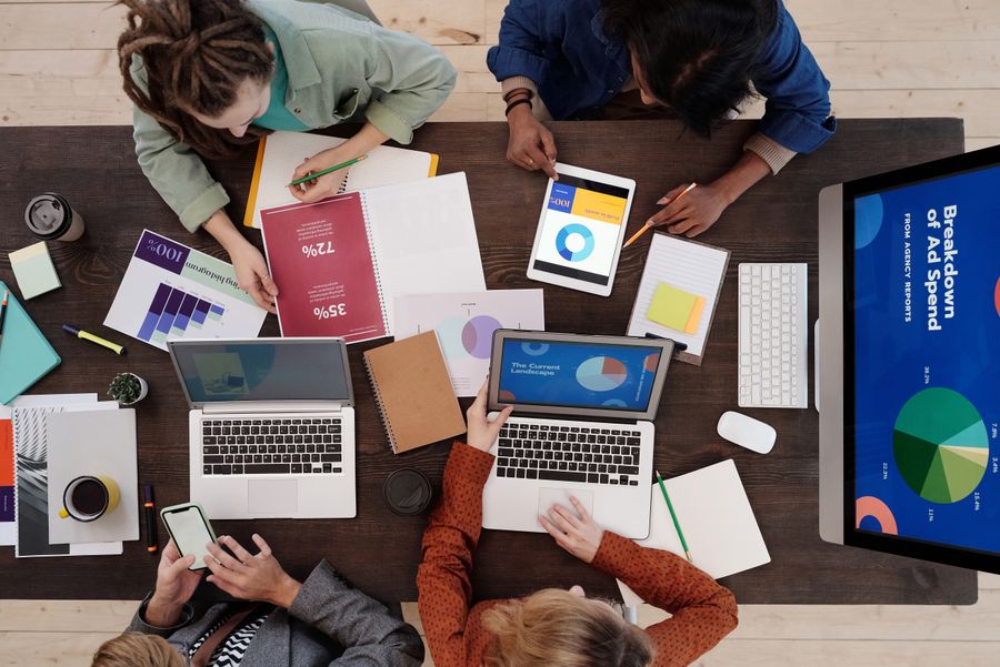 A group of people discussing charts — Start from a template, finish in minutes layers-panel mockup