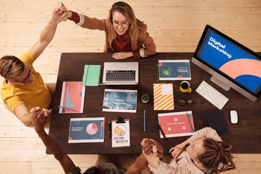 People sitting at the table — PhotoAI Company — AI photo & design editor resize-canvas mockup