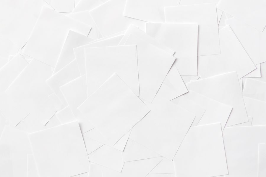 Clean sheets of white paper scattered on surface — stock photo for PhotoAI Company — AI photo & design editor