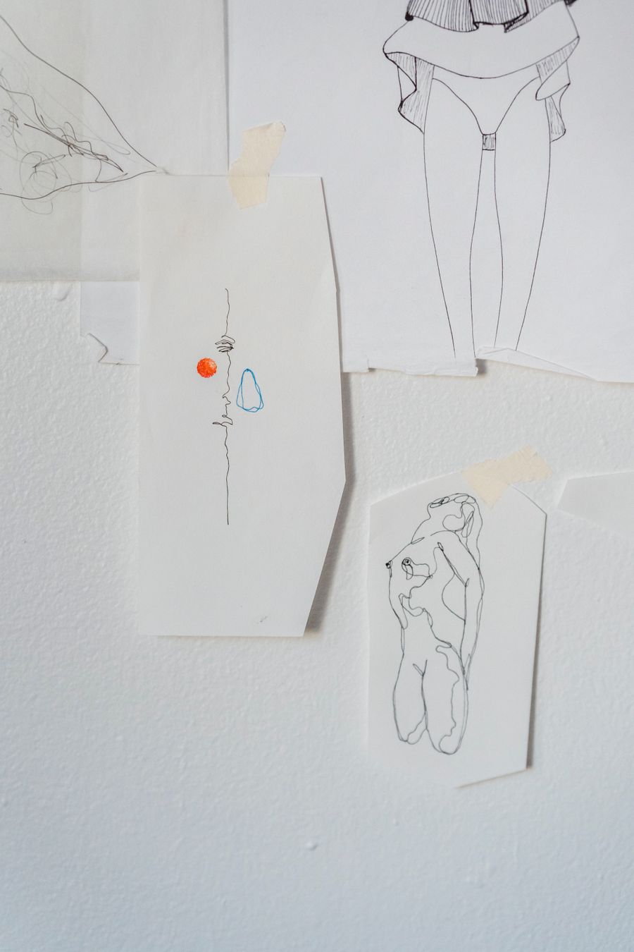 Drawings taped on a wall — stock photo for Get a Design