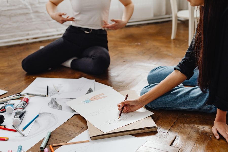 A woman drawing on white paper — Terms of Service layers-panel mockup
