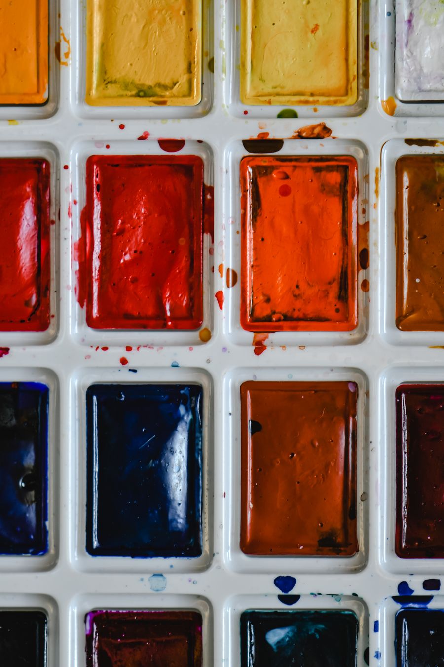 A messy water color palette in plastic container — Start designing free phone mockup