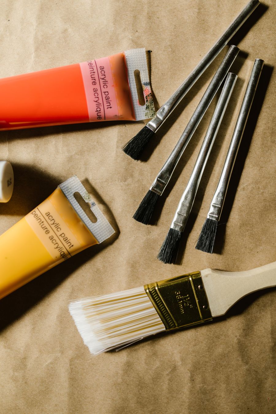 Paintbrushes and paint tubes on table — stock photo for PhotoAI Company — AI photo & design editor